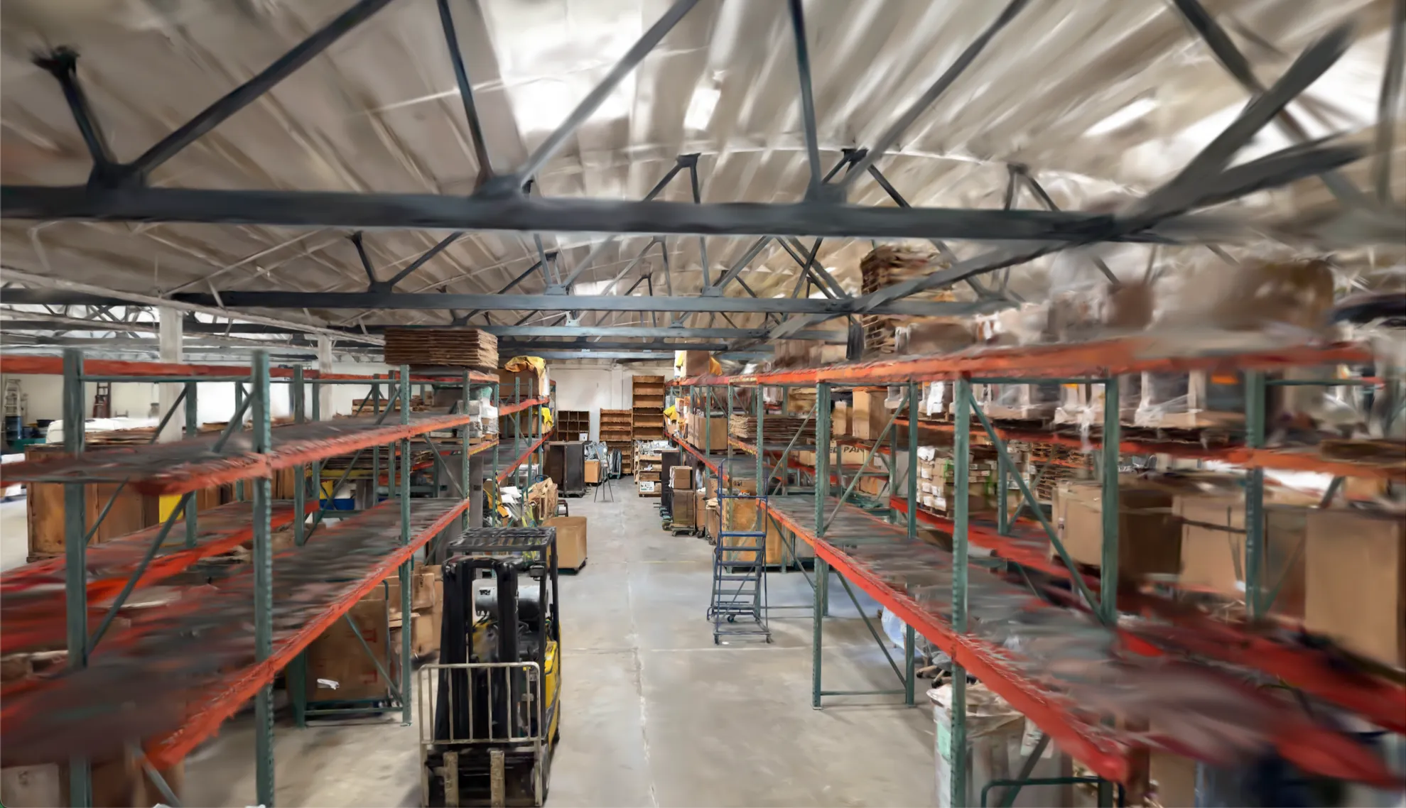 Reconstructed warehouse aisle with a forklift and pallet racking in Claryo's World Model