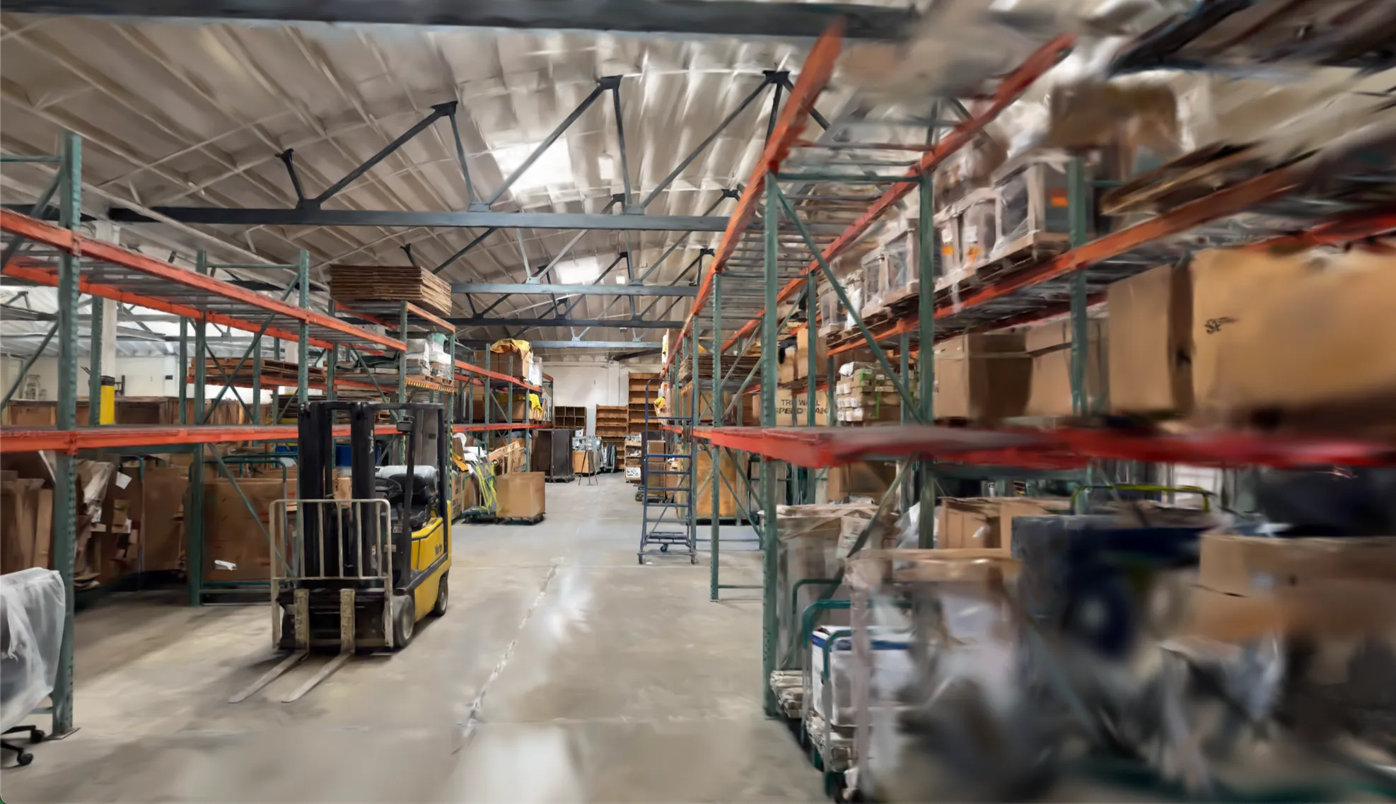 Reconstructed warehouse aisle with a forklift and pallet racking in Claryo's World Model